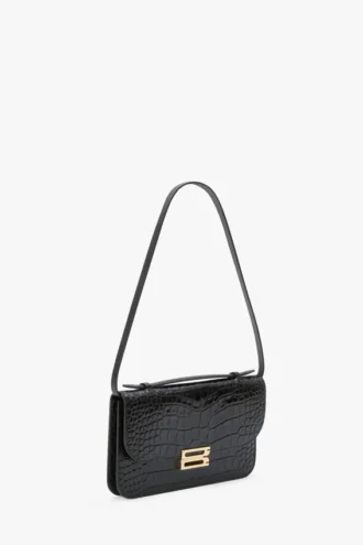Pochette Dorian en piel negra repujada