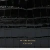 Pochette Dorian en piel negra repujada