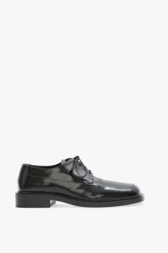 Zapatos planos con cordones de piel negra